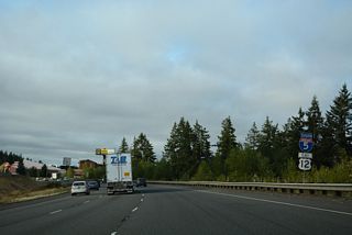 U.S. 12 east overlaps with I-5 south for 19.95 miles from Grand Mound to Centralia and Chehalis. Old U.S. 99 shifts to the west side of the freeway southward to Harrison Avenue in Centralia.