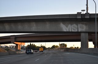 Interstate 5 turns south through the three-wye interchange with SR 16.