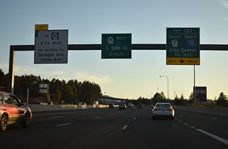 Shifting southwest between McKinley Park and the Tacoma Dome, I-5 advances 0.75 miles west to Exit 133 for I-705 north and SR 7 south.