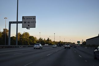 The HOV-2 lane also has a ramp for Downtown Federal Way. The left exit connects with an access road to a roundabout between S 317th Street and 28th Avenue S.