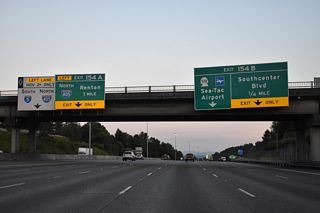 Southcenter Boulevard is a parallel road linking the Southcenter Mall area with S 154th Street (former SR 518) at Riverton Heights. Left Exit 154 A departs in one mile for Interstate 405 north to Renton, Newcastle and Bellevue.