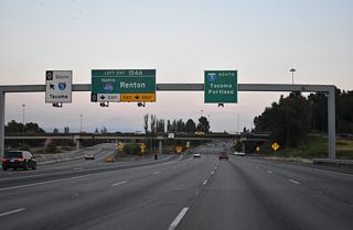 Direct HOV lane connections between I-5/405 are available due to the left side ramp. Interstate 405 first opened between Tukwila and Renton on September 3, 1965 as SR 405 (AARoads Wiki, 2025).