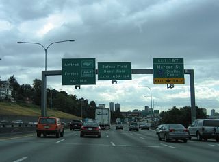 Construction on the Mercer Corridor Project began in 2010 that rebuilt the Mercer Street corridor west from I-5. The eastbound flowing street was redesigned into a six lane boulevard through the South Lake Union neighborhood west toward Seattle Center. Broad Street, a 1950s-era expressway linking Valley Street west with Seattle Center, was removed as part of the project to rebuild the street grid surrounding Mercer Street and SR 99 (N Aurora Avenue).