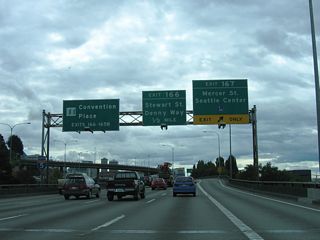 Exit 167 parts ways with the Interstate 5 viaduct ahead of the Lakeview Boulevard overpass. Mercer Street replaced Valley Street as the gateway into South Lake Union. A half diamond interchange (Exit 166) with Stewart Street follows on I-5 south in a half mile.