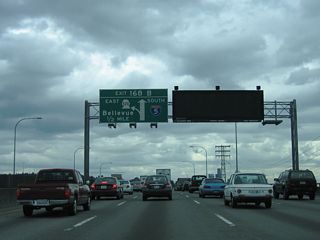 SR 520 heads east from Exit 168 B through Montlake to Lake Washington. Doubling as a commuter route to the high-tech business centers east of the Lake, the 12.82 mile long route is a limited access highway from Interstate 5 to Bellevue and Redmond.