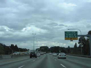 The merging c/d roadway from Exit 173 forms an auxiliary lane to Exit 172. NE 85th Street stems west from Interstate 5 to Greenwood, Loyal Heights and Golden Gardens Park on Shilshole Bay.