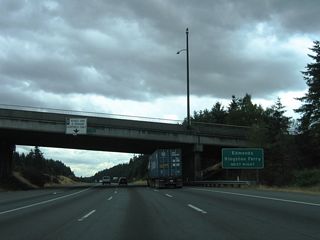 Interstate 5 next meets SR 104 at a three quarter cloverleaf interchange (Exit 177). The state route is one of a handful of that utilize Puget Sound ferry crossings to make connections with land-based routes. SR 104 continues west from Edmonds via ferry to Kingston in Kitsap County.