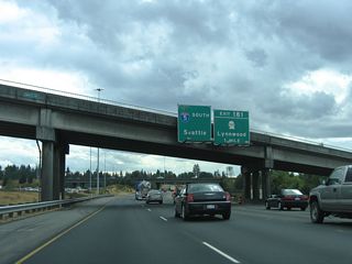Eliminating a weaving traffic pattern, 2010-12 construction lengthened the off-ramp for Exit 181 with a tunnel below the SR 525 entrance ramp. Exit 181 to SR 524 (196th Street SW) previously departed a mile south of the Maple Road over crossing.