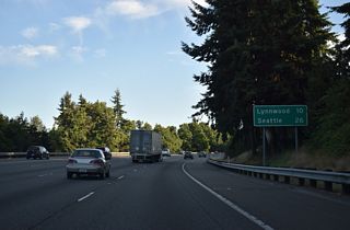 Due to the local terrain, Interstate 5 south travel at an elevation above the northbound roadway through south Everett. Lynnwood is the next Snohomish County city on I-5. Seattle is 26 miles southward.