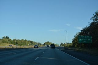 Old U.S. 99 ties into 300th Street NW nearby. Eastward from Exit 215, 300th Street NW ends at a rural residential area.