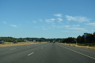 Shifting southeastward again, Interstate 5 travels 27 miles to Everett and 54 miles to Seattle.