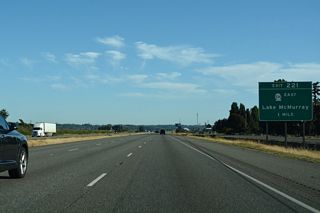 SR 534 west and Pioneer Highway (former SR 530) north come together at a diamond interchange (Exit 221) near Conway in one mile.