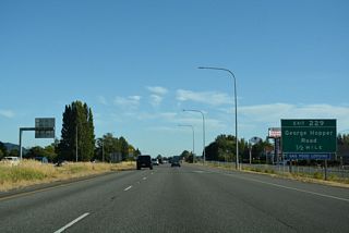 Goldenrod Road accompanies Interstate 5 south across Gages Slough to the diamond interchange (Exit 229) with George Hopper Road. Old U.S. 99 remains to the east along Burlington Boulevard, serving Cascade Mall.
