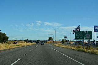 George Hopper Road mainly serves an assortment of businesses including car dealerships and big box retail. The road arcs eastward from Old U.S. 99 to an industrial area as Port Drive.