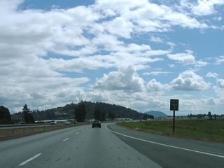 WSDOT often posts reassurance shields for U.S. and state routes within a green box sign. Occasionally Interstate shields receive the same practice, as was the case with this I-5 marker south of Cook Road. The assembly was replaced by 2014.
