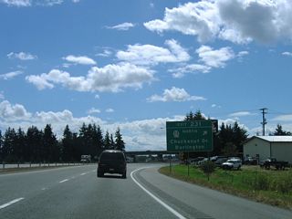 A folded diamond interchange with roundabouts joins I-5 with SR 11 (Chuckanut Drive) north and Burlington Boulevard (old U.S. 99) south at Exit 231. Old U.S. 99 parallels Interstate 5 to the east from Cook Road southward to SR 20 (Avon Avenue) at the Burlington city center.