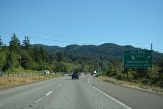 SR 11 travels west along Old Fairhaven Parkway to Chuckanut Drive (former U.S. 99 Alternate) south on the ascent to Chuckanut Village and Larrabee State Park along Chuckanut Bay. Connelly Avenue ties into Exit 250 from 36th Street to the east.