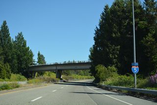 The first southbound shield for the 1,381 mile long route of Interstate 5 between Blaine and San Ysidro, California precedes the H Street overpass.