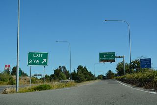Leaving the customs and immigration station, traffic separates for the southbound beginning of Interstate 5 and Exit 276 to SR 548 (Peace Portal Drive) and the Blaine city center.