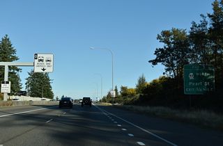 SR 163 (Pearl Street) commences northbound from SR 16 at Exit 3. SR 163 travels 3.37 miles to the WSDOT Ferry Point Defiance Terminal.