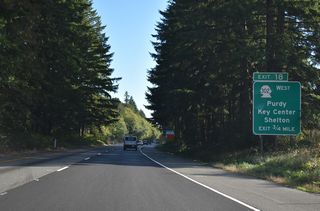 SR 302 Spur branches south from a wye interchange (Exit 18) with SR 16 along Purdy Drive into the unincorporated community of Purdy.