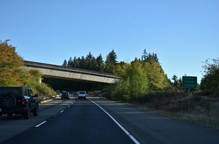 Shifting east to bypass Purdy, SR 16 eastbound enters Pierce County just beyond the gore point for Exit 18.