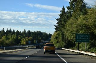 Entrances for Haven of Rest Cemetery and local businesses follow mile marker 13 along SR 16 westbound.