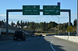 Sprague Avenue stems north from Exit 1 A below S 25th Street to S 19th Street. The five lane boulevard extends north from SR 16 to Division / 6th Avenues.