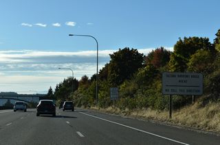 SR 16 curves northwest from Exit 4 to the Tacoma Narrows Bridge. Tolls are only charged along the span in the eastbound direction.