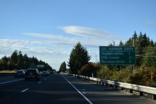 SR 16 reaches the city of Gig Harbor at the diamond interchange (Exit 10) with Olympic Drive NW.