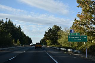 A dumbbell interchange joins SR 16 with Burnham Drive at Exit 14.