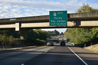 SR 302 commences north into the unincorporated community of Purdy from a wye interchange (Exit 15) with SR 16 westbound.