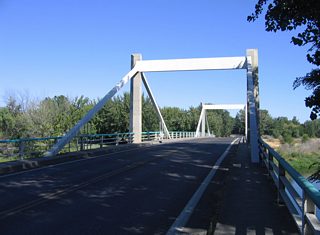 SR 225 (1st Street) spans the Yakima River on the Benton City - Kiona Bridge. The 400 foot long steel box girder bridge opened in 1957 and is on the National Register of Historic Places.