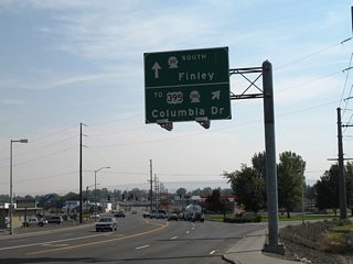 SR 397 south leaves the Cable Bridge for Gum Street at the ramp to Columbia Drive west. Columbia Drive leads through the city center to the interchange between SR 240 and U.S. 395 at the Blue Bridge south end.