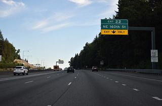 Leaving the Sammamish River Valley, I-405 advances south to the diamond interchange (Exit 22) with NE 160th Street near Kingsgate.