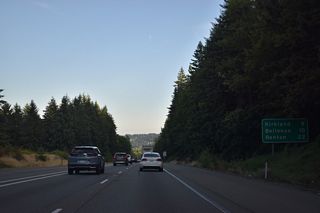 Distance sign posted eight miles north of Kirkland on Interstate 405. Bellevue and Renton round out the regular control cities for the freeway loop.