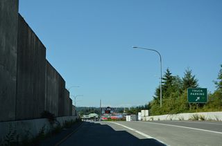 A truck parking area precedes the turn off for the commercial vehicle lanes to the port of entry.