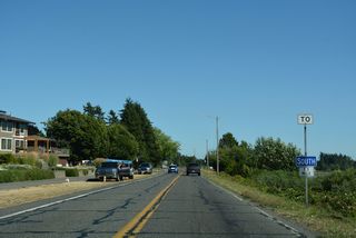 Since replaced, the first in a series of trailblazers for Interstate 5 posted along SR 548 (Peace Portal Drive) in Blaine precedes 4th Street.