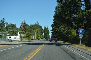 Hughes Avenue intersects SR 548 (Peace Portal Drive) 0.4 miles from the entrance ramp to Interstate 5 southbound.