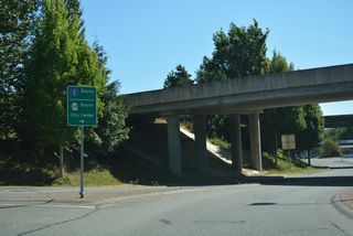 SR 548 continues through the dumbbell interchange (Exit 276) with I-5 to the roundabout with the southbound ramps.