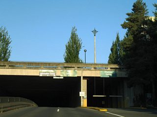 Entering the 14th Avenue SE tunnel, motorists split into a four lane tunnel and ramps to the garage below East Plaza of the Capitol Campus.