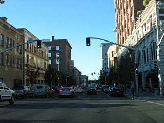 1st Avenue travels east, complimenting Sprague Avenue west, as the main routes to and from Peaceful Valley and the Maple Street Bridge to the west.
