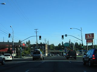 Maple Street south at 3rd Avenue east. 2nd and 3rd Avenues represent an unsigned business loop for Interstate 90 east from Sunset Boulevard.