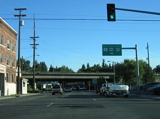 Traveling through the signalized intersection with 4th Avenue, Maple Street nears the westbound ramp for I-90/U.S. 2-395. U.S. 195 travels 95 miles to Lewiston, Idaho from I-90 southeast through Hangman Valley along an expressway leading south to Spangle.