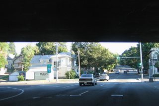 A split diamond interchange joins Interstate 90 & U.S. 2-395 with Maple Avenue via connections with 4th Avenue west and 5th Avenue east. The eastbound on-ramp to Idaho depart from 5th Avenue at Walnut Street, one block east of Maple Street.
A rare state-named shield for I-90 was posted at the turn onto 5th Avenue. This was replaced with a new guide sign including the control city of Coeur d'Alene by 2011.