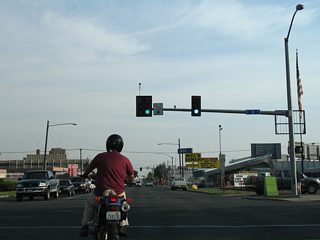 D Street meets Main Street at the next southbound traffic light.