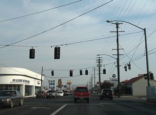 South 1st Street expands into a conventional commercial arterial on the exit of downtown Yakima. Arlington Street and South 3rd Street meet the original U.S. 97 at this signalized intersection.