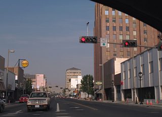 Yakima Avenue bisects downtown Yakima to I-82/U.S. 12-97 (Exit 33). The four lane boulevard passes by the A.E. Larson Building and The Tower, in this scene beyond 1st Street (former U.S. 97).