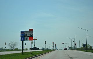 Wis 42 south departs from I-43 south to briefly merge with U.S. 151.