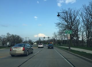 College Avenue approaches John Street just east of the Fox River. John Street becomes County KK and runs southeast towards Harrison.